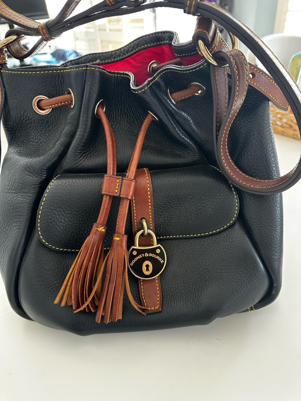 Dooney & Bourke Black Leather Drawstring Bucket Bag with Brown Trim